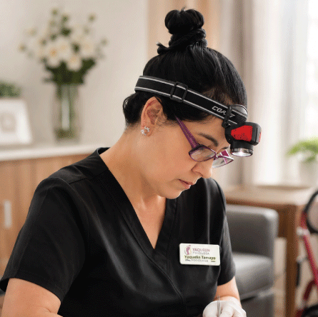 Nurse performing a foot care treatment